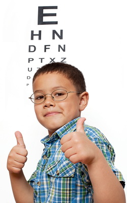 boy-in-front-of-eye-chart-vertical