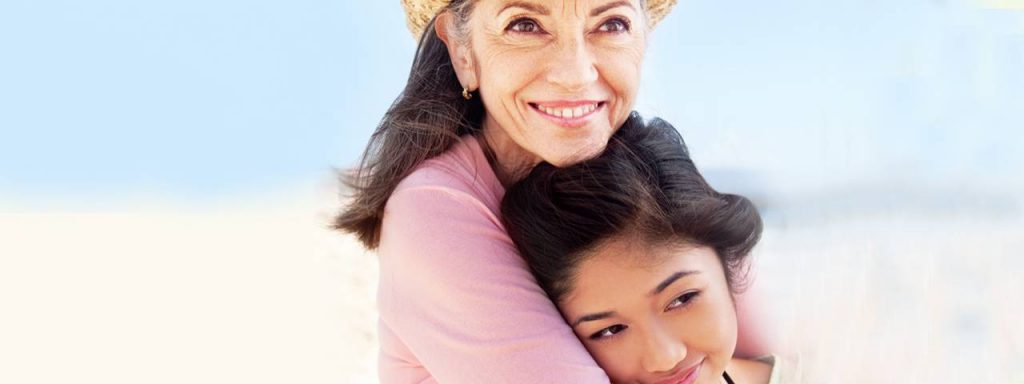 Grandmother-and-Child-Hugging-1280x480-1-1024x384-1